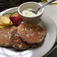 <p>Welsh breakfast cakes with lemon ricotta and fruit at Wobble Cafe in Ossining.</p>