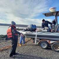 <p>Fire marine unit members getting ready to search for the woman jumper.</p>