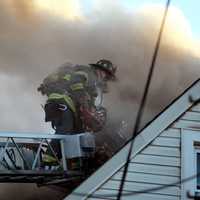 <p>Paramedics tended to a firefighter for a shoulder injury.</p>