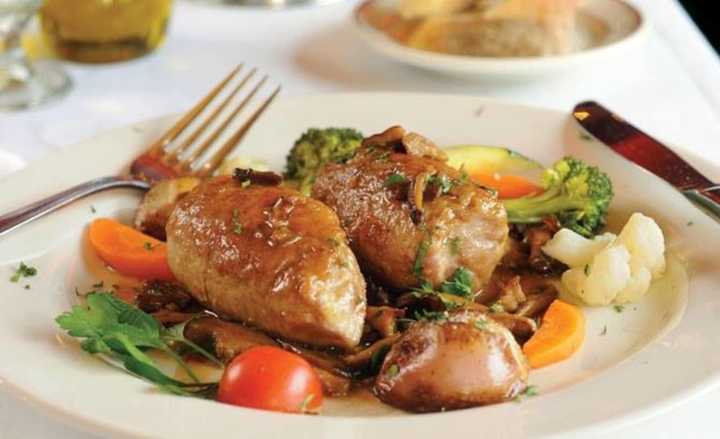 Veal Rolantini at Louie&#x27;s is stuffed with prosciutto, ,mozzarella in a mushroom demi-glaze.