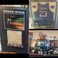 <p>Sports memorabilia recovered in the execution of a search warrant was purchased with stolen funds, authorities said.</p>