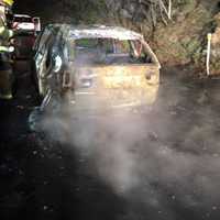 <p>No one was injured, but a car was destroyed in an overnight fire on Route 8 in Shelton.</p>