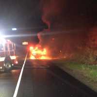 <p>Crews from Echo Hose Hook &amp; Ladder arrive at the scene of the burning car on Route 8 overnight.</p>