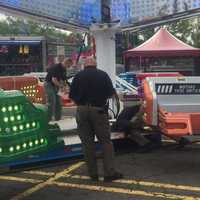 <p>State Troopers with the Fire &amp; Explosion Investigation Unit inspect carnival rides at the Danbury Fair Mall last month. This is one duty for the State Police unit.</p>