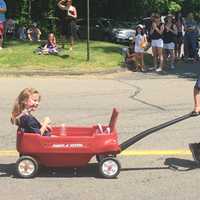 <p>A marcher waves during Saturday&#x27;s Memorial Day parade in Redding.</p>