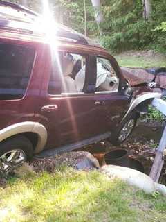 Rockland Car Crash Leaves SUV Hanging Over Small Stream