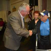 <p>Bill Protze shakes the hand of Saddle Brook Mayor Robert White.</p>