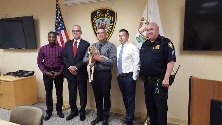 Officers of the Wallkill Police Department, from left to right, Sgt. Mclymore, Chief Hertman, ( holding Izzie) Det. DiNapoli, Det. Hults, and Sgt. Weissman, helped located Izzie.