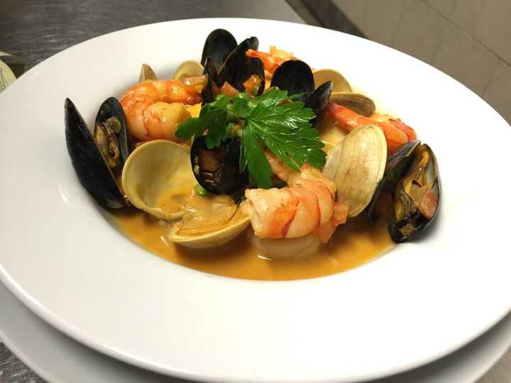 Mariscada dish at Ibiza in Danbury (shrimp, sea scallops, mussels, little neck clams, coconut and saffron broth).