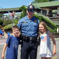 <p>Mahwah Police Officer William Hunt and offspring at Ridgewood&#x27;s Fourth of July parade.</p>