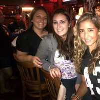 <p>From left: Ashely Collazo, Jess Mirto and Vitoria Bernardes sit at the bar at Michael&#x27;s Tavern.</p>