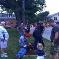 <p>Staatsburg Fire Commissioner Todd Bender and Firefighter Chris Johnson work to save a little girl&#x27;s My Little Pony from a storm drain.</p>