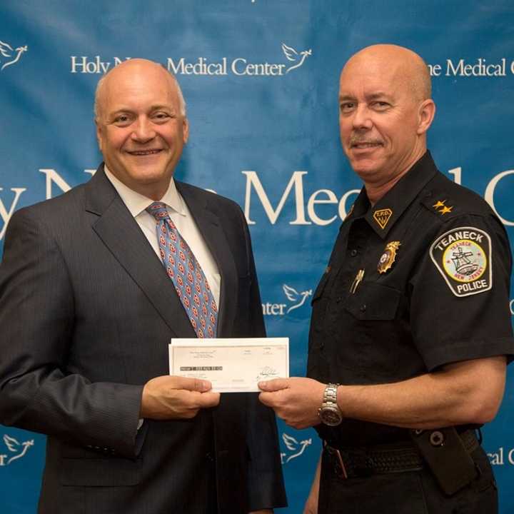 Michael Maron, president and CEO of Holy Name Medical Center with Teaneck Police Chief Robert Carney.