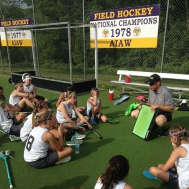 Mahwah High School coach Brian Girardi talks to X-Treme Lax Factory&#x27;s club team before a game.