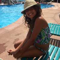 <p>Gia Pierro, 9 of Hawthorne, catches rays poolside.</p>