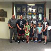 <p>Local children and teens show their appreciation for the State Police with a visit complete with a thank you card as part of the Blue Wave Shore to Shore effort.</p>