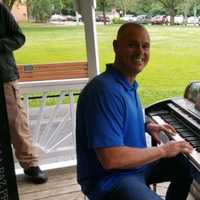 <p>Mayor LaBarbiera gives the piano a test-run.</p>