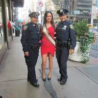 <p>Jackie DiMaggio flanked by two NYC Officers at the Columbus Day Parade.</p>