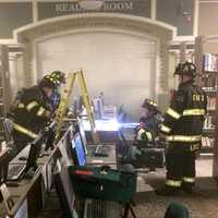 <p>Firefighers and library staff used hand-held extinguishers to snuff the flames.</p>