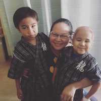 <p>Agatha Okumara with her boys.</p>