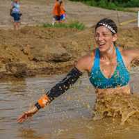 <p>Hart makes her way through the mud pit.</p>