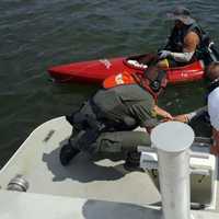 <p>Officers and a medic rescued a boater whose kayak had sunk off the coast of Greenwich this weekend.</p>