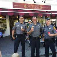 <p>Ridgefield police eating ice cream at Deborah Ann’s Cops and Cones event.</p>