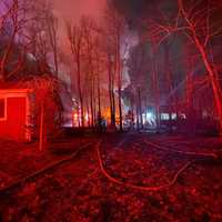 <p>Fire crews spent three hours extinguishing a blaze that collapsed a two-story apartment building.</p>