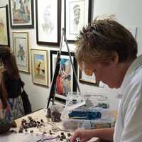 <p>Darlene Garrison creates jewelry while at Workspace Collective on Main Street in Danbury.</p>