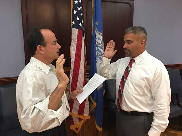 Mayor Joe Ganim swears in city native Ralphie Fonseca as the newest member of the Bridgeport Board of Education.