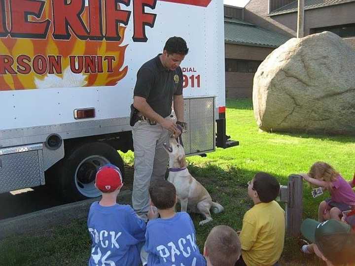 K9 Scooter shown with his handler Deputy Brad Lerner recently passed away. He served as part of the arson unit.