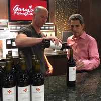 <p>Gary Fisch, right, owner of Gary&#x27;s Wine &amp; Marketplace.</p>