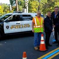 <p>Rochelle Park Police Chief Robert Flannelly and Police Commissioner Jay Kovalcik joined DPW laborer Roy Spraguer in paint the township&#x27;s thin blue line.</p>