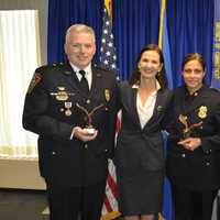 <p>Lt. Terry Blake, U.S. Attorney Deirdre Daly, Sgt. Sofia Gulino and Officer Felipe Taborda during a Friday Community Policing Awards ceremony.</p>