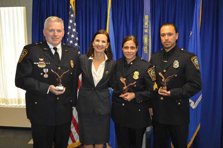 Lt. Terry Blake, U.S. Attorney Deirdre Daly, Sgt. Sofia Gulino and Officer Felipe Taborda during a Friday Community Policing Awards ceremony.