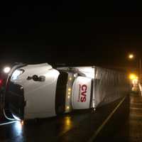 <p>A rolled-over tractor-trailer is closing part of westbound I-84 in Danbury early Wednesday.</p>