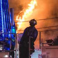 <p>Flames blew out the rear upper floors.</p>