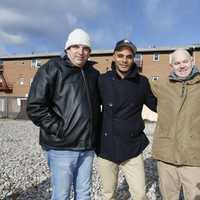 <p>Marcus Wallace, second from left, with Solomon Randelman, far left, Phillip Lavigne and Sheridan Ogden at the exact location in Teaneck where the trio saved him in 1985.</p>