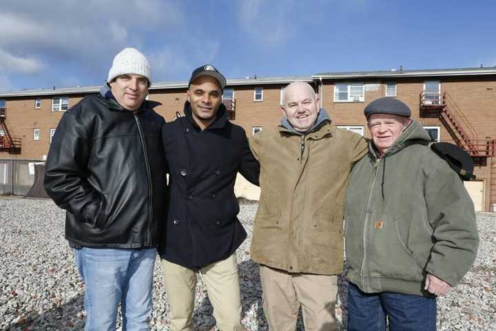 Marcus Wallace, second from left, with Solomon Randelman, far left, Phillip Lavigne and Sheridan Ogden at the exact location in Teaneck where the trio saved him in 1985.