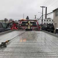 <p>Tow trucks adorned with flowers led a procession for Sal Brescia.</p>