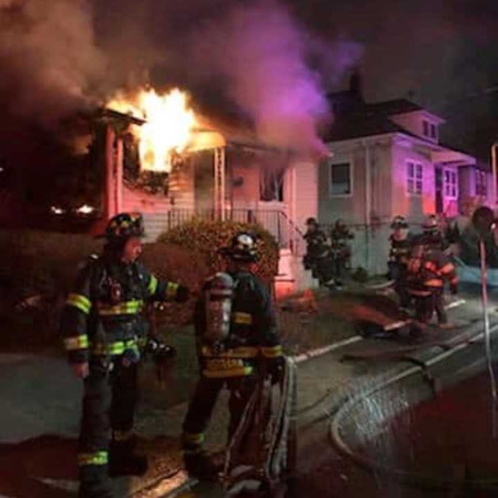 Inwood firefighters battle a house fire on Monroe Avenue.