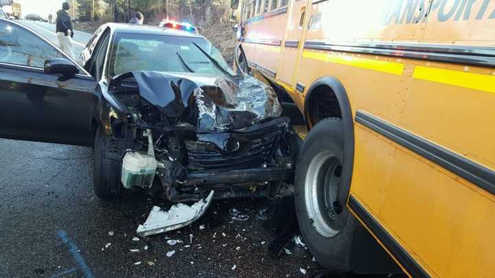 A crash between a taxi and a school bus on Friday sent both drivers to the hospital.