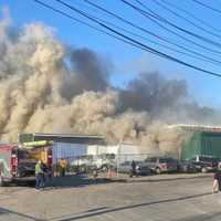 <p>Numerous fire departments at work.</p>