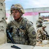 <p>Army National Guard Sgt. Geovany Martinez, with Co. C, 1st Battalion, 69th Infantry, watches his field of fire after securing a building during a live-fire exercise at Ft. Polk, La.,</p>