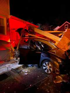 Vehicle Crashes Through Fairfield County Garage, Then Hits Neighboring Home