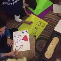 <p>Making signs before the New York City rally.</p>