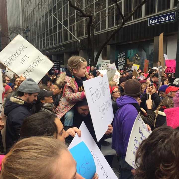 Alissa Smith of Fairfield is part of this crowd rallying Saturday in the Women&#x27;s March on New York City with people of all ages.