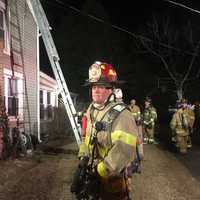 <p>Firefighters from the Bethel and Stony Hill departments respond to a fire Saturday evening on Walnut Hill Road.</p>