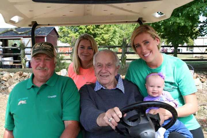 Harvey Ort Sr., center, is auctioning off dozens of his antique tractors.