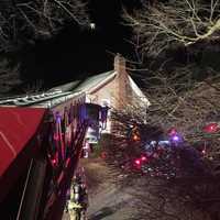 <p>Firefighters from the Bethel and Stony Hill departments respond to a chimney fire Saturday evening on Walnut Hill Road.</p>